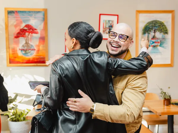 Friends connecting and celebrating at a Colado Latino Network event in Baltimore