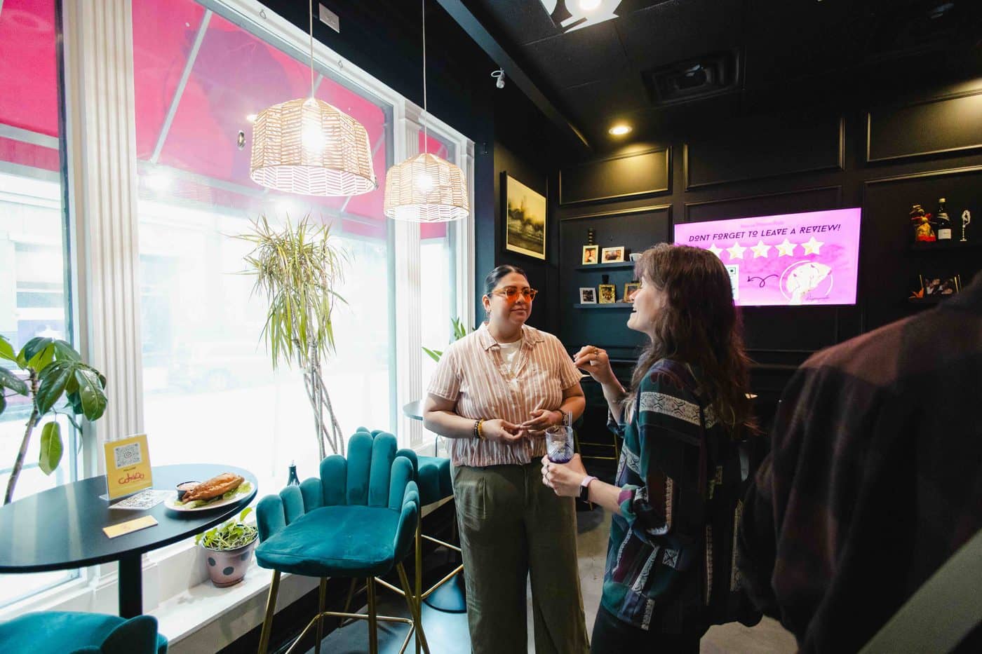 Two Latina business owners meeting for the first time at a Colado Latino Network gathering in Baltimore, MD