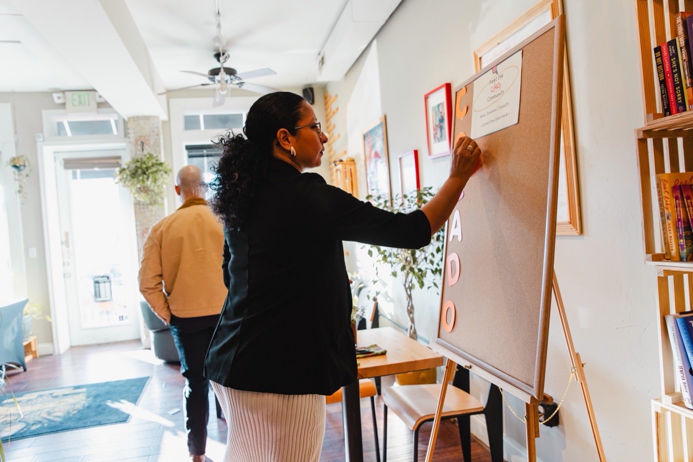 Guests pinning their name, business, and industry to the Meet the Colado Community board at the Bodega and Vino event in Baltimore