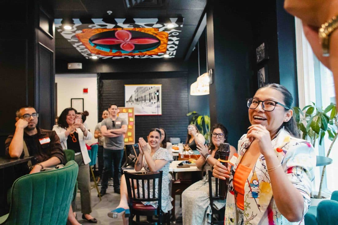 Two Colado Latino Network members talking at a Baltimore gathering